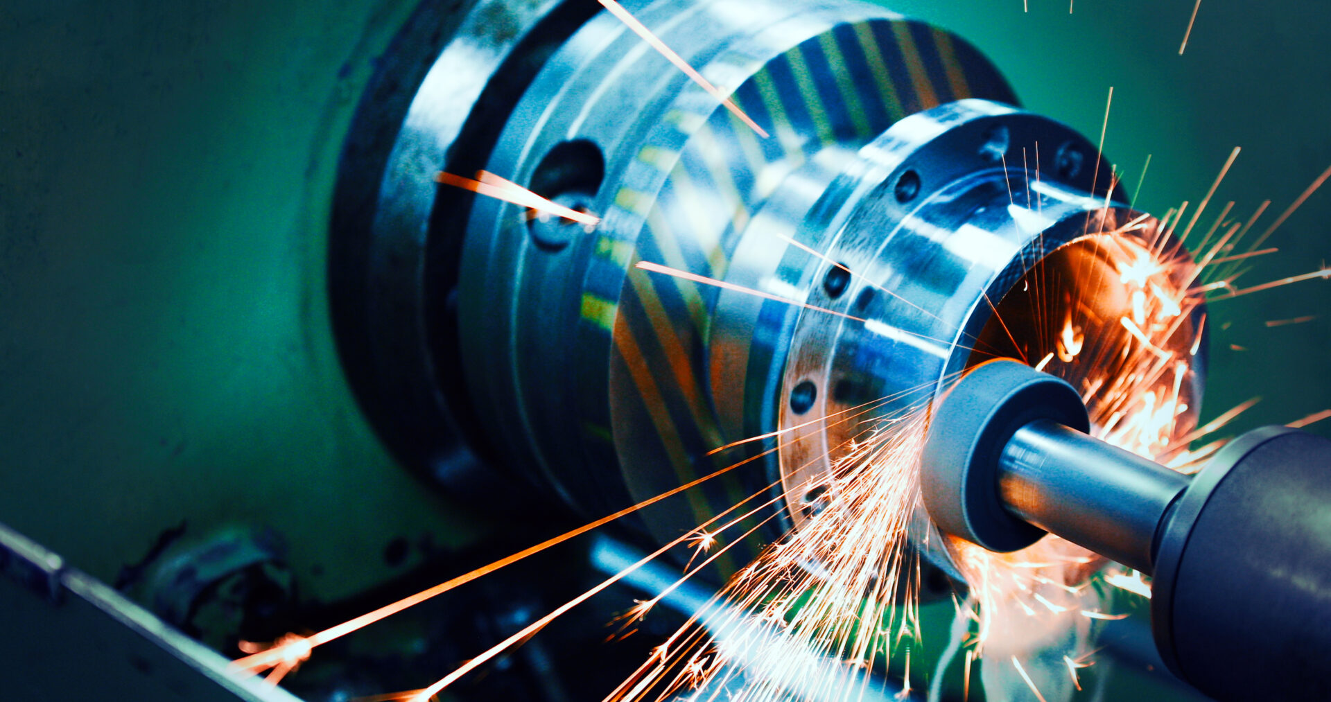 Machining-Tolerances-sparks-flying-while-machine-griding-and-finishing-db-fabrication-plus-inc