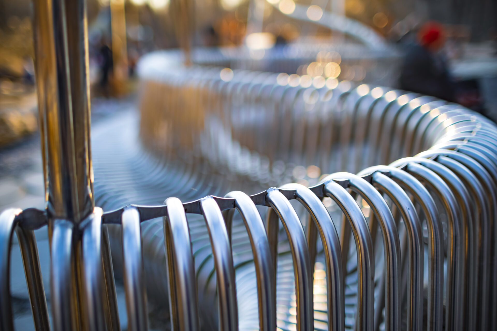 riverside-close-up-street-bench-metal-pipes-arranged-Architectural-Metal-Fabrication